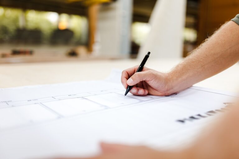 A carpenter working on a furniture construction in a carpentry workshop